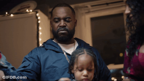 Man In Blue Jacket Holding Little Girl GIF