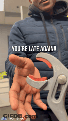 Man In Blue Jacket Holding Wrench You're Late Again GIF