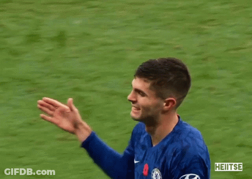 Man In Blue Jacket Hugging Man In Blue Shirt Number 10 GIF