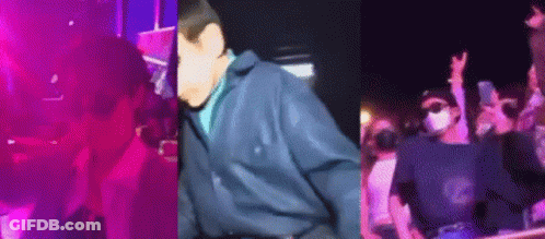 Man In Blue Jacket In Front Of Crowd GIF