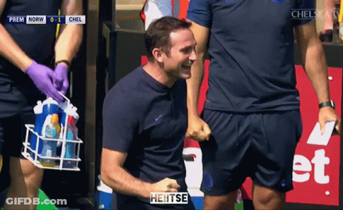 Man In Blue Jacket In Front Of Crowd Saying Heitse GIF