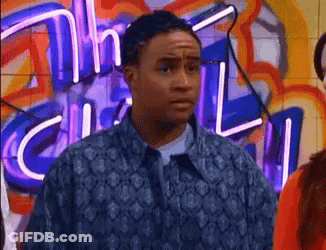 Man In Blue Jacket In Front Of Neon Sign Saying Chill GIF