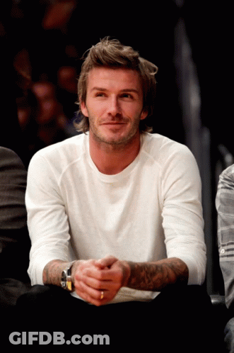 Man In Blue Jacket Kicks Soccer Ball GIF
