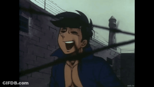 Man In Blue Jacket Laughing In Front Of Building GIF