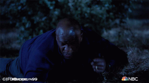 Man In Blue Jacket Lying On Ground Brooklyn99 GIF