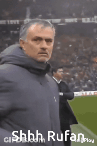 Man In Blue Jacket On Soccer Field With Shhh Rufan GIF