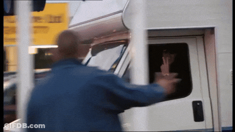 Man In Blue Jacket Reaching Into White Van GIF