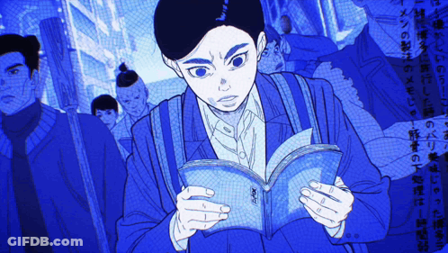 Man In Blue Jacket Reading Foreign Language Book GIF