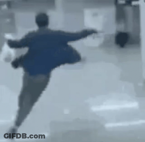 Man In Blue Jacket Running With Bag GIF