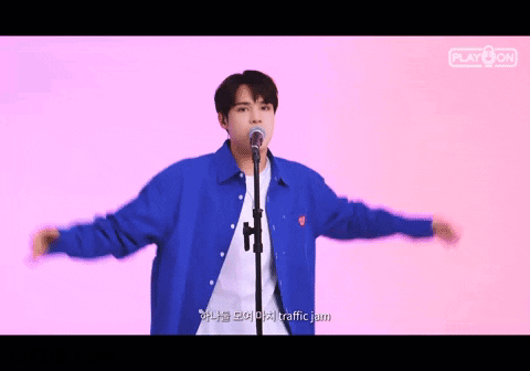 Man In Blue Jacket Singing Into Microphone GIF