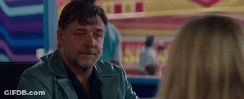Man In Blue Jacket Sitting At Table GIF