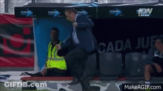 Man In Blue Jacket Standing Before Cada Jue Sign GIF