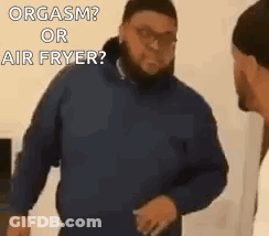 Man In Blue Jacket Talking To Another Man GIF