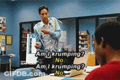 Man In Blue Jacket Talking To Man At Desk GIF