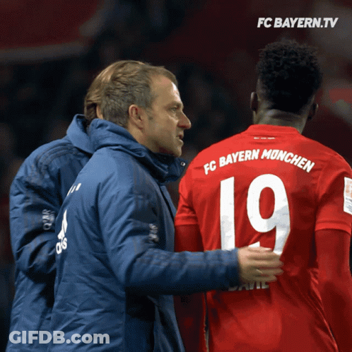 Man In Blue Jacket Talking To Man In Red Jersey 19 GIF