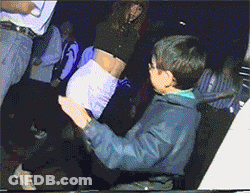 Man In Blue Jacket Touching Woman's Butt In Club GIF