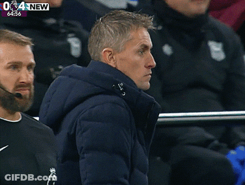 Man In Blue Jacket Watching Soccer Game 64:57 GIF