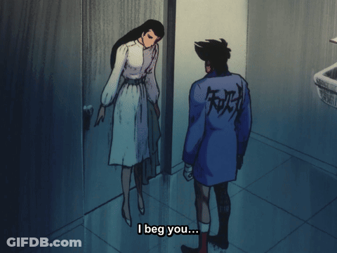 Man In Blue Jacket With Chinese Writing Talks To Woman In White Dress GIF