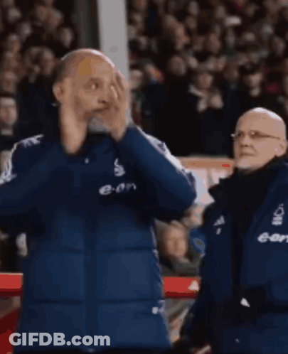 Man In Blue Jacket With E-On On Front GIF