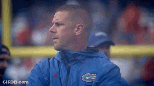 Man In Blue Jacket With Gator Logo GIF