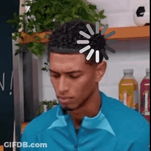 Man In Blue Jacket With Loading Screen On Head GIF