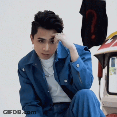 Man In Blue Jacket With Question Mark On Shirt GIF