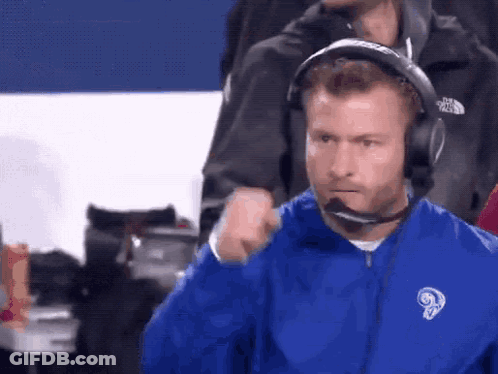 Man In Blue Jacket With Ram And Headphones GIF