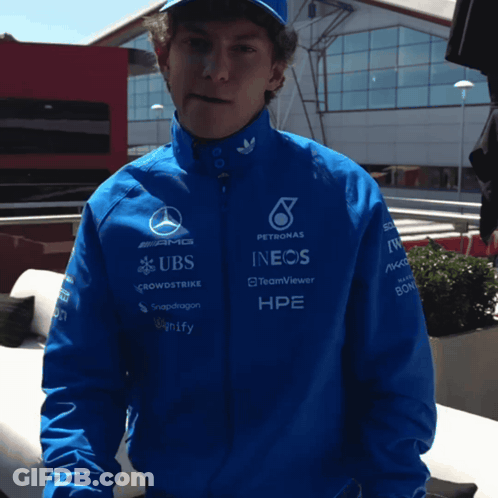 Man In Blue Jacket With UBS And INEOS Sponsors GIF