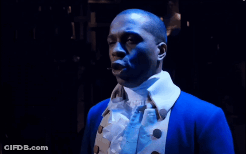 Man In Blue Jacket With White Collar Looking Down GIF