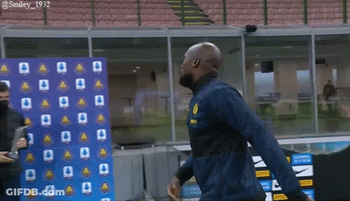 Man In Blue Jacket With Yellow Smiley GIF