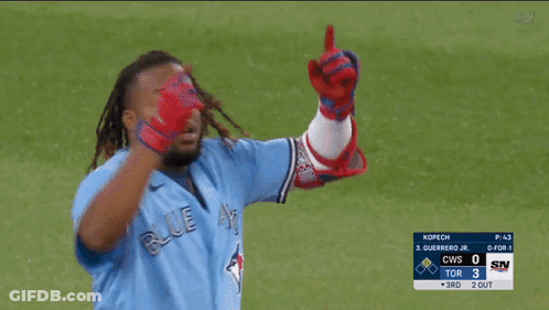 Man In Blue Jays Jersey Arms Up GIF