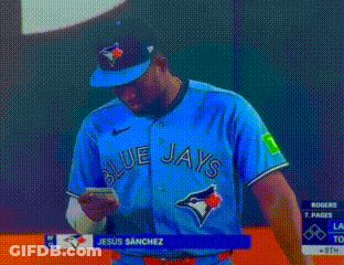 Man In Blue Jays Jersey Looking At Phone GIF