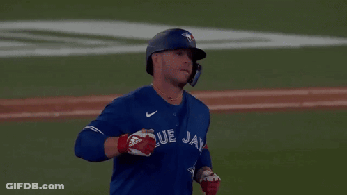 Man In Blue Jays Jersey Standing On Field GIF
