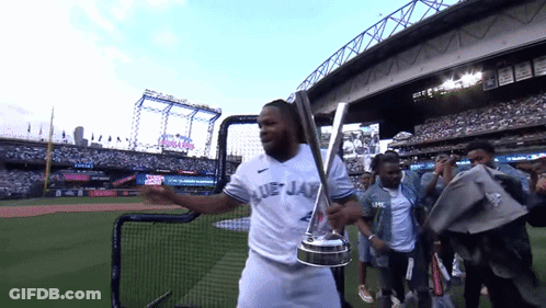 Man In Blue Jays Uniform Holding Trophy GIF