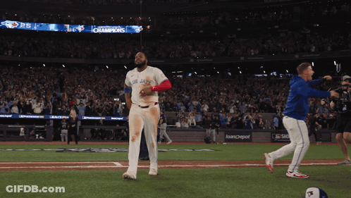 Man In Blue Jays Uniform Walking GIF