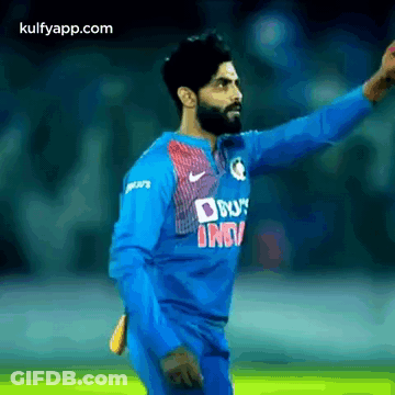 Man In Blue Jersey With Hand Outstretched GIF