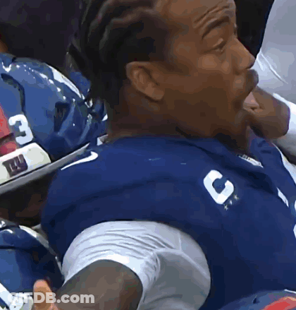 Man In Blue Jersey With Letter C Sitting In Stadium GIF