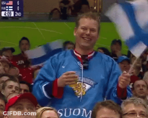 Man In Blue Jersey With Suon Holding Flag GIF