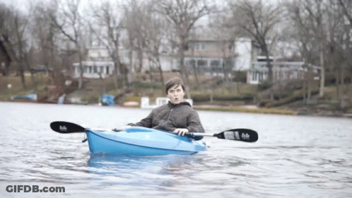Man In Blue Kayak With Black Paddle Saying Fade GIF