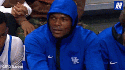 Man In Blue Kentucky Sweatshirt Sitting In Stands GIF