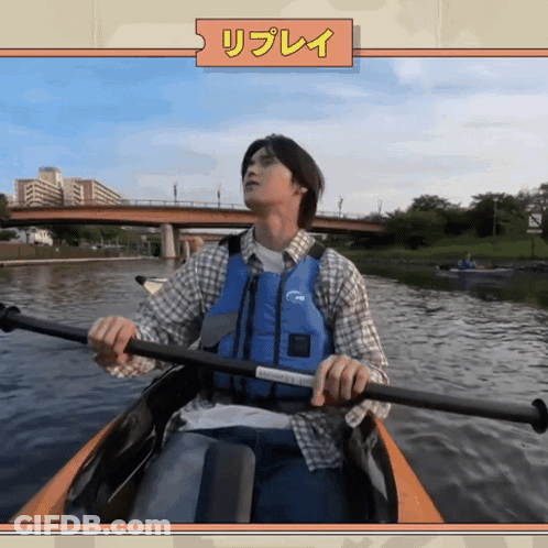 Man In Blue Life Vest Paddling Kayak GIF