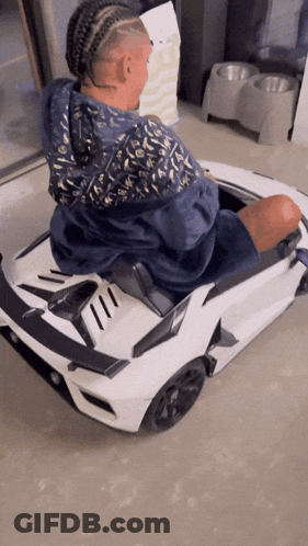 Man In Blue Louis Vuitton Jacket In Toy Car GIF