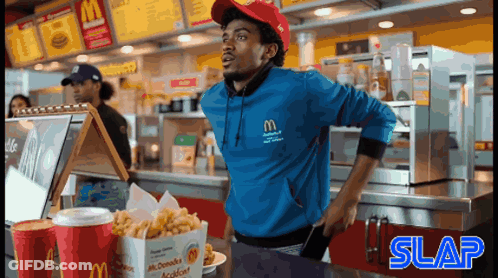 Man In Blue McDonald's Sweatshirt At Counter GIF