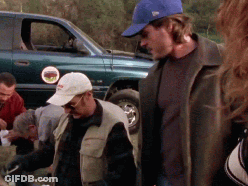 Man In Blue New Era Hat Next To Man GIF