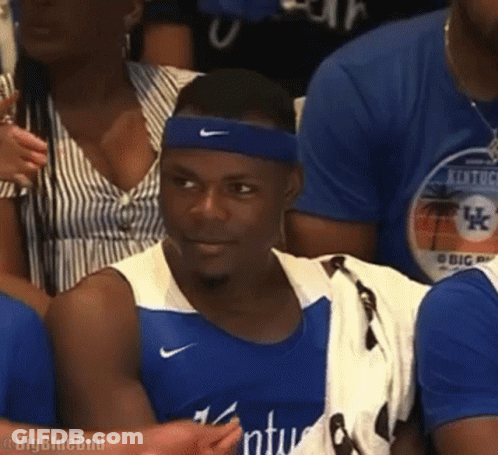 Man In Blue Nike Headband Sitting In Crowd GIF