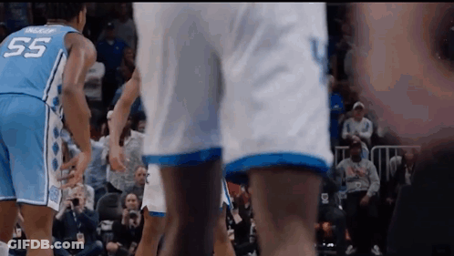 Man In Blue Nike Headband Sitting In Crowd GIF