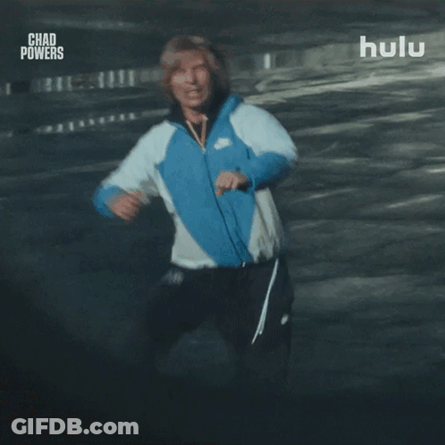 Man In Blue Nike Jacket Running In Parking Garage GIF