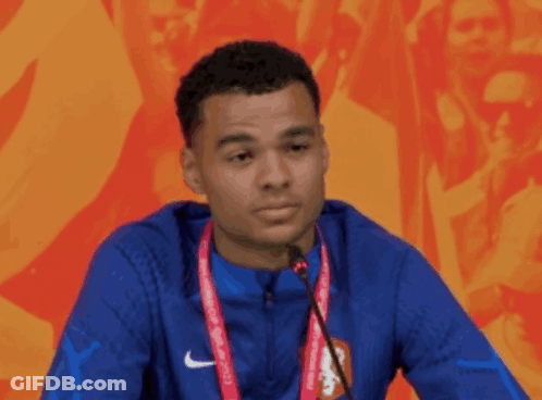 Man In Blue Nike Jacket Speaking GIF