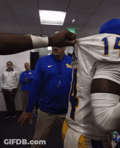 Man In Blue Nike Jacket Talking To Football Player #14 GIF