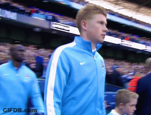 Man In Blue Nike Jacket Walking In Crowd GIF